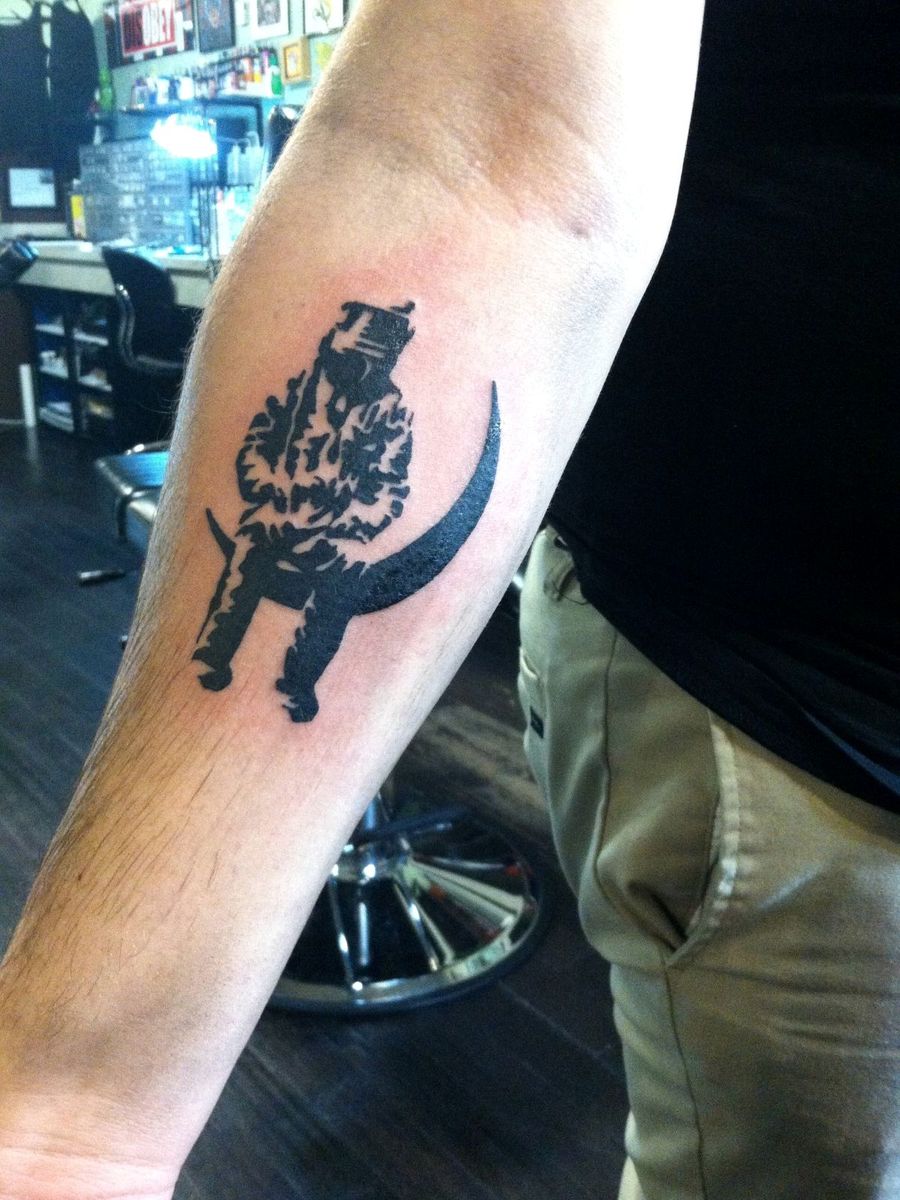 Blackwork bear and crescent moon tattoo on a forearm