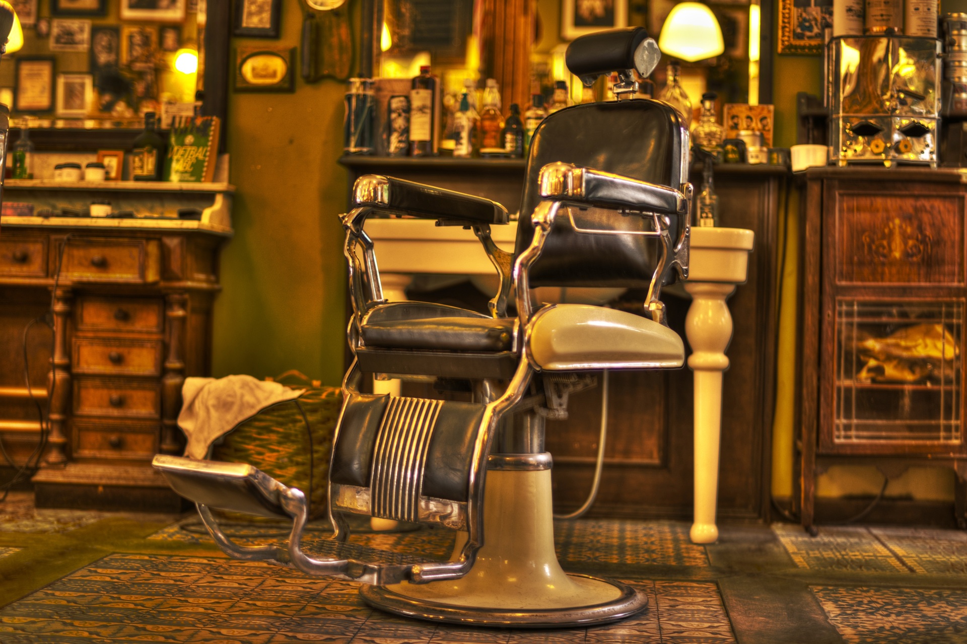 Open floor barbershop with a row of dark chairs